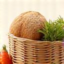 Icône de pain rustique et d'un panier de légumes pour la cuisine paysanne
